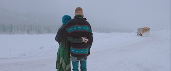 Movie still from “The Sweet Hereafter” (1997), directed by Atom Egoyan – A man and a woman standing in the middle of a snow covered field; Wide shot, Over the shoulder angle