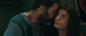 Movie still from “The Sweet Hereafter” (1997), directed by Atom Egoyan – A man and a woman face to face with their eyes closed; Close Up shot, Over the shoulder angle