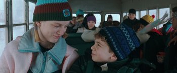 Movie still from “The Sweet Hereafter” (1997), directed by Atom Egoyan – A woman and a boy on a school bus; Close Up shot, Over the shoulder angle