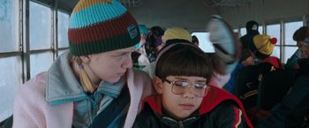 Movie still from “The Sweet Hereafter” (1997), directed by Atom Egoyan – Two young people sitting together on a bus; Close Up shot, Over the shoulder angle