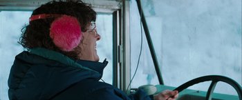 Movie still from “The Sweet Hereafter” (1997), directed by Atom Egoyan – A woman wearing a pink ear muff and a blue jacket; Close Up shot, Over the shoulder angle