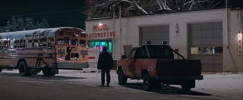 Movie still from “The Sweet Hereafter” (1997), directed by Atom Egoyan – A man standing in front of a truck in the snow; Wide shot, High angle