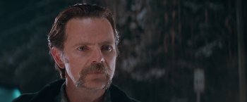 Movie still from “The Sweet Hereafter” (1997), directed by Atom Egoyan – A person with a mustache; Close Up shot, Low angle