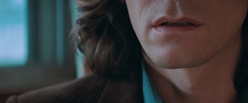Movie still from “The Sweet Hereafter” (1997), directed by Atom Egoyan – View of a person's face and hair; Extreme Close Up shot, Over the shoulder angle
