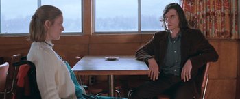 Movie still from “The Sweet Hereafter” (1997), directed by Atom Egoyan – A man sitting at a table in front of a woman; Medium shot, Over the shoulder angle