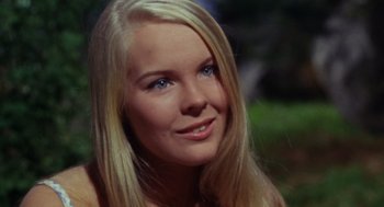Movie still from “The Swimmer” (1968), directed by Sydney Pollack – A beautiful blonde woman with blue eyes; Close Up shot, High angle