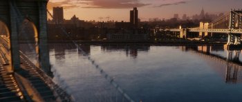 Movie still from “The Switch” (2010), directed by Josh Gordon – A view of a city from a bridge at sunset; Extreme Wide shot, High angle