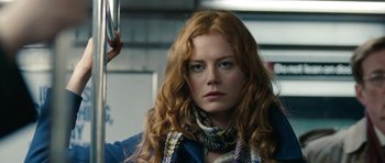 Movie still from “The Switch” (2010), directed by Josh Gordon – A person with long red hair; Close Up shot, Over the shoulder angle
