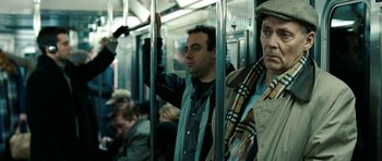 Movie still from “The Switch” (2010), directed by Josh Gordon – Two men on a train looking out of the window; Medium shot, Over the shoulder angle