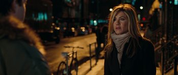 Movie still from “The Switch” (2010), directed by Josh Gordon – A woman standing on the side of a road at night; Close Up shot, Over the shoulder angle