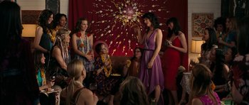 Movie still from “The Switch” (2010), directed by Josh Gordon – A group of women standing in front of a red curtain; Wide shot, Over the shoulder angle