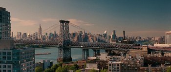 Movie still from “The Switch” (2010), directed by Josh Gordon – A view of a bridge with a city in the background; Extreme Wide shot, High angle
