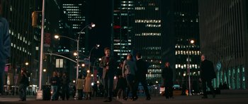 Movie still from “The Switch” (2010), directed by Josh Gordon – A group of people walking down a street at night; Extreme Wide shot, High angle