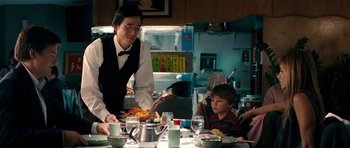 Movie still from “The Switch” (2010), directed by Josh Gordon – A man and a boy are sitting at a dinner table; Medium shot, Over the shoulder angle