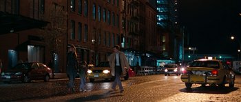 Movie still from “The Switch” (2010), directed by Josh Gordon – A man and a woman walking down a street at night; Wide shot, Over the shoulder angle
