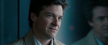 Movie still from “The Switch” (2010), directed by Josh Gordon – A person wearing a suit and tie; Close Up shot, Over the shoulder angle