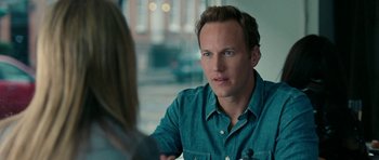 Movie still from “The Switch” (2010), directed by Josh Gordon – A man sitting in front of a woman in front of a window; Close Up shot, Over the shoulder angle