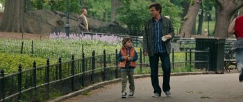 Movie still from “The Switch” (2010), directed by Josh Gordon – A man and a boy walking down a sidewalk; Medium shot, Over the shoulder angle