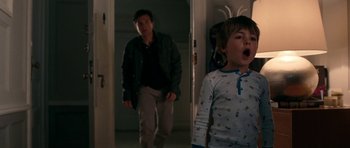 Movie still from “The Switch” (2010), directed by Josh Gordon – A man and a child in a room; Medium shot, Over the shoulder angle