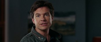 Movie still from “The Switch” (2010), directed by Josh Gordon – A person wearing a jacket; Close Up shot, Over the shoulder angle