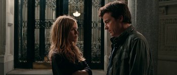 Movie still from “The Switch” (2010), directed by Josh Gordon – A man and a woman standing next to each other in front of a building; Close Up shot, Over the shoulder angle