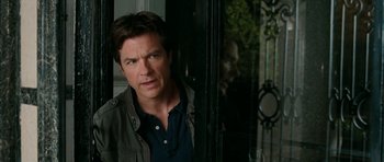 Movie still from “The Switch” (2010), directed by Josh Gordon – A person standing in front of a window; Close Up shot, Over the shoulder angle
