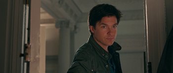 Movie still from “The Switch” (2010), directed by Josh Gordon – A person wearing a jacket; Close Up shot, Over the shoulder angle
