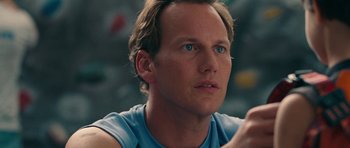Movie still from “The Switch” (2010), directed by Josh Gordon – A person wearing a blue t - shirt; Close Up shot, Over the shoulder angle