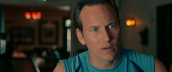 Movie still from “The Switch” (2010), directed by Josh Gordon – A man's face in a blue shirt; Close Up shot, Over the shoulder angle