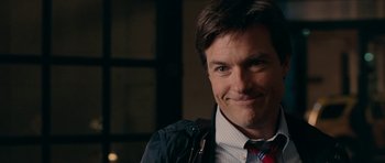 Movie still from “The Switch” (2010), directed by Josh Gordon – A person wearing a jacket and a tie; Close Up shot, Over the shoulder angle