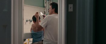 Movie still from “The Switch” (2010), directed by Josh Gordon – A man and a woman in a bathroom with a mirror; Medium shot, Over the shoulder angle