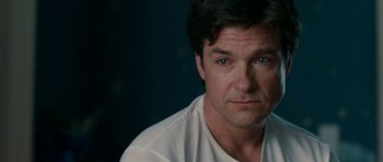 Movie still from “The Switch” (2010), directed by Josh Gordon – A person wearing a white t - shirt; Close Up shot, Over the shoulder angle
