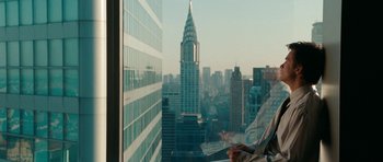 Movie still from “The Switch” (2010), directed by Josh Gordon – A view of a city from a skyscraper window; Wide shot, Over the shoulder angle