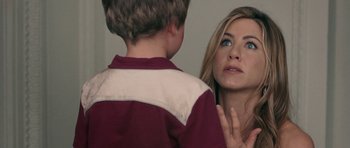 Movie still from “The Switch” (2010), directed by Josh Gordon – A young boy looking at a young woman in a mirror; Close Up shot, Over the shoulder angle
