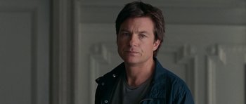 Movie still from “The Switch” (2010), directed by Josh Gordon – A person wearing a shirt and jacket; Close Up shot, Over the shoulder angle