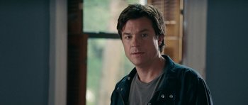 Movie still from “The Switch” (2010), directed by Josh Gordon – A person wearing a shirt and jacket; Close Up shot, Over the shoulder angle