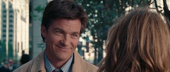 Movie still from “The Switch” (2010), directed by Josh Gordon – A person wearing a suit and tie; Close Up shot, Over the shoulder angle