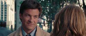 Movie still from “The Switch” (2010), directed by Josh Gordon – A person wearing a suit and tie; Close Up shot, Over the shoulder angle