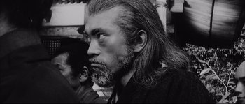 Movie still from “The Sword of Doom” (1966), directed by Kihachi Okamoto – An older man with long hair and a beard; Close Up shot, Low angle