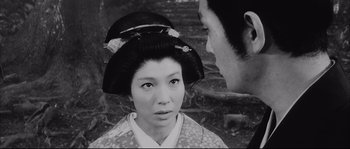 Movie still from “The Sword of Doom” (1966), directed by Kihachi Okamoto – An old photo of a man and a woman; Close Up shot, Over the shoulder angle