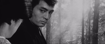Movie still from “The Sword of Doom” (1966), directed by Kihachi Okamoto – Black and white photograph of a young man in a forest; Close Up shot, Low angle