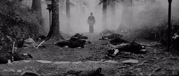 Movie still from “The Sword of Doom” (1966), directed by Kihachi Okamoto – A man standing in the middle of a forest with dead bodies on the ground; Wide shot, High angle