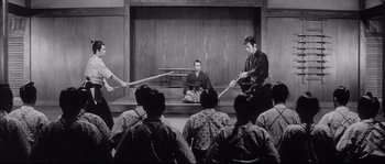 Movie still from “The Sword of Doom” (1966), directed by Kihachi Okamoto – A group of men in traditional japanese garb holding swords; Wide shot, High angle