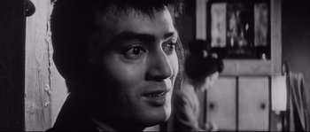 Movie still from “The Sword of Doom” (1966), directed by Kihachi Okamoto – A man's face in black - and - white; Close Up shot, Low angle