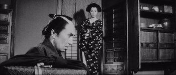 Movie still from “The Sword of Doom” (1966), directed by Kihachi Okamoto – A man and a woman dressed in traditional japanese clothing; Medium shot, Low angle