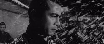 Movie still from “The Sword of Doom” (1966), directed by Kihachi Okamoto – Black and white photograph of a man looking out a window; Close Up shot, Low angle