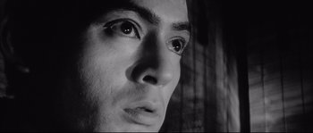 Movie still from “The Sword of Doom” (1966), directed by Kihachi Okamoto – A man's eyes and face; Extreme Close Up shot, Low angle