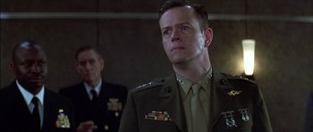 Movie still from “The Tailor of Panama” (2001), directed by John Boorman – A man in a military uniform looking to his left; Close Up shot, Low angle