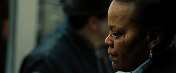 Movie still from “The Taking of Pelham 123” (2009), directed by Tony Scott – A woman with blood all over her face and neck; Close Up shot, Over the shoulder angle