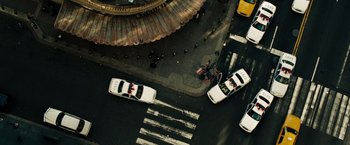 Movie still from “The Taking of Pelham 123” (2009), directed by Tony Scott – A view from above of a busy street with cars and pedestrians; Extreme Wide shot, Overhead angle
